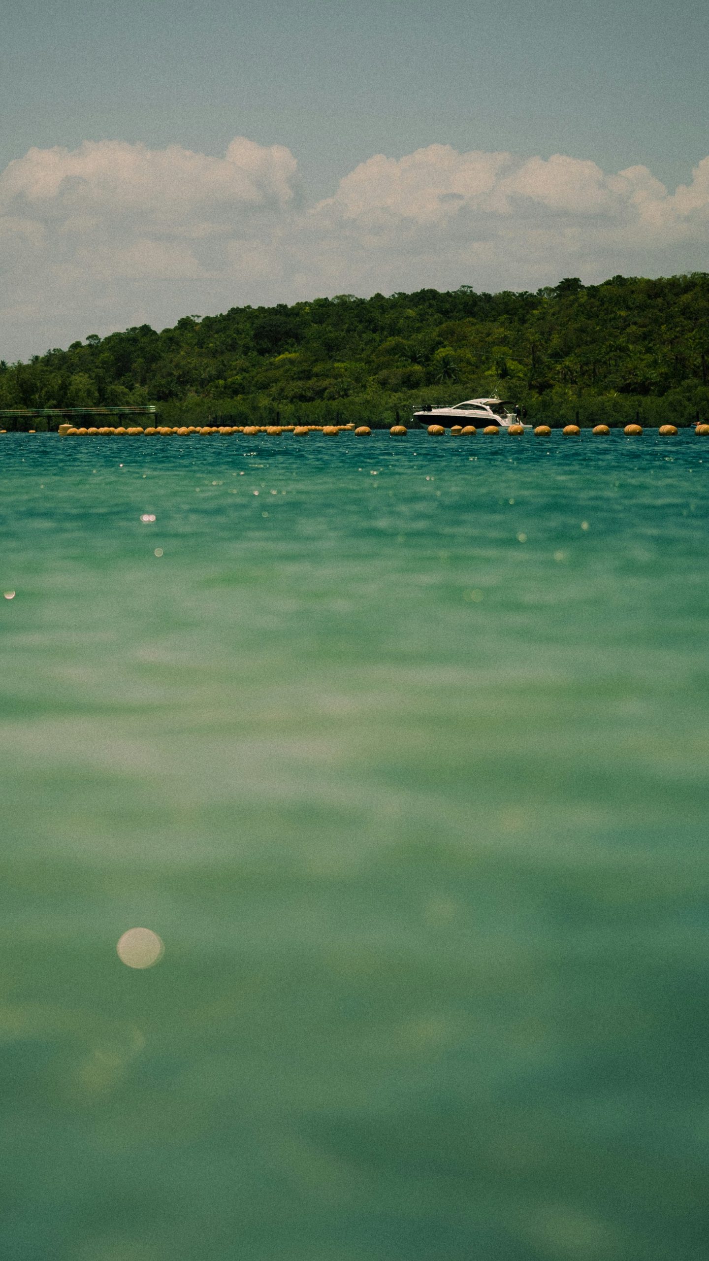 Yacht sailing through turquoise waters in The Bahamas